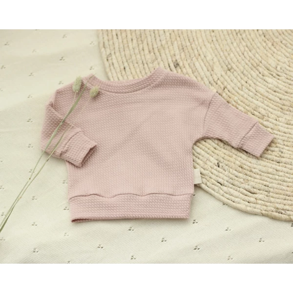 Een oversized sweater van mini cable stof in de kleur nude pink